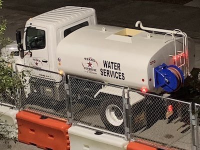 Texas Outhouse water services truck that can be mobilized during emergency waste cleanup services by texas outhouse in houston, texas.