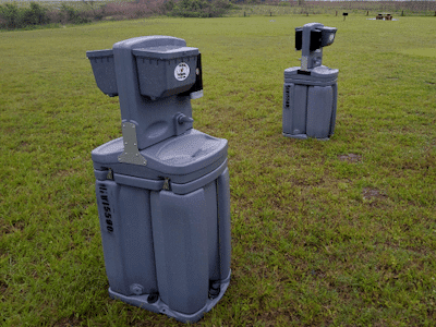 A portable hand wash station rented for use at an outdoor event.