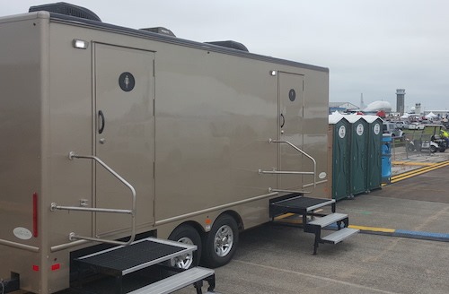 A luxury event restroom trailer at an outdoor event in the Greater Houston area