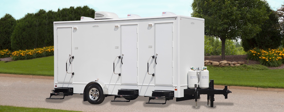 A 3-stall portable shower and toilet combination rental.