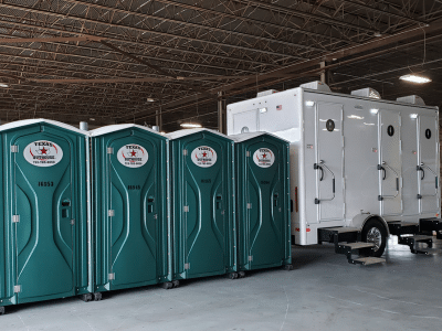 Texas Outhouse portable toilets and restroom trailers next to each other