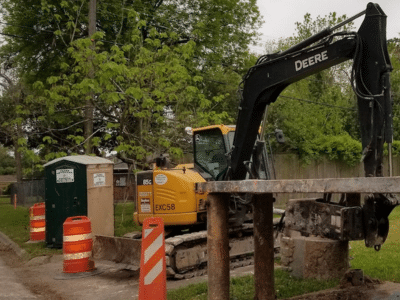 Texas Outhouse portable toilet positioned on an active construction job site, highlighting clean, reliable sanitation for construction crews.